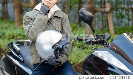 A woman who is worried while riding a bike 111433598