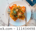 fried shrimp with noodle on a plate 111434498