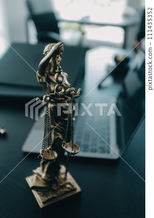 Judge gavel with Justice lawyers having team meeting at law firm background. Concepts of Law and Legal services. 111435352