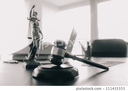 Judge gavel with Justice lawyers having team meeting at law firm background. Concepts of Law and Legal services. Judge gavel with Justice lawyers having team meeting at law firm background. Concepts of Law and Legal services. 111435353