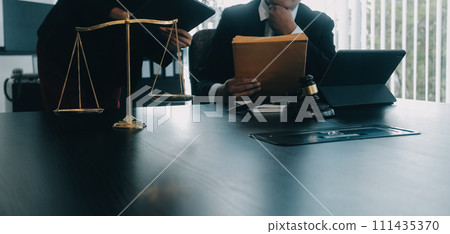 Judge gavel with Justice lawyers having team meeting at law firm background. Concepts of Law and Legal services. Judge gavel with Justice lawyers having team meeting at law firm background. Concepts of Law and Legal services. 111435370