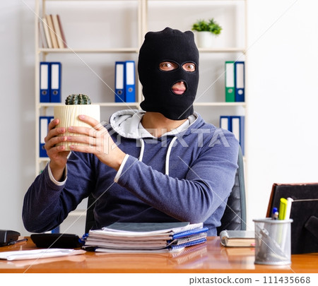 Male thief in balaclava in the office 111435668