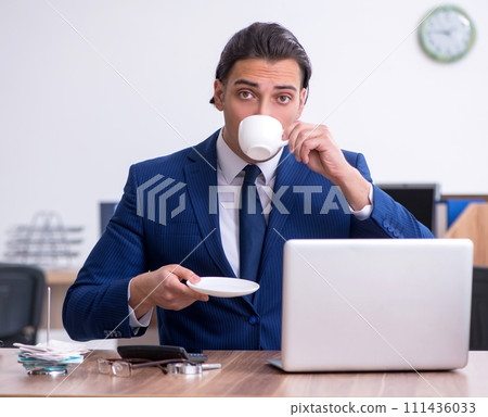 Young male businessman working in the office Young male businessman working in the office 111436033