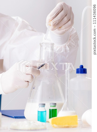 Food scientist testing new stuff in the lab 111436096