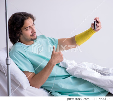 Young man staying in hospital in transfusion concept 111436122
