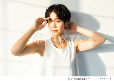 A woman basking in the morning sun 111436405