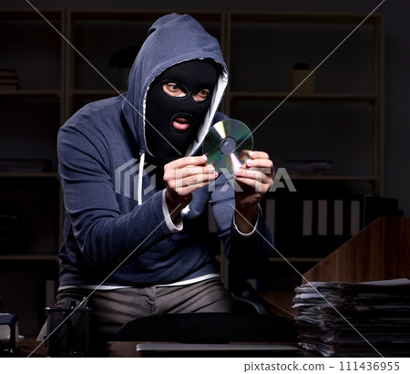 Male thief in balaclava in the office night time 111436955