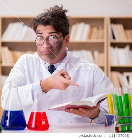 Mad crazy scientist doctor doing experiments in a laboratory Mad crazy scientist doctor doing experiments in a laboratory 111437068