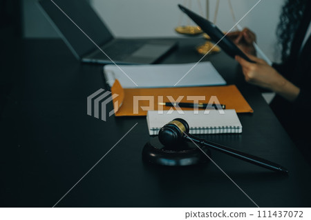 Judge gavel with Justice lawyers having team meeting at law firm background. Concepts of Law and Legal services. Judge gavel with Justice lawyers having team meeting at law firm background. Concepts of Law and Legal services. 111437072