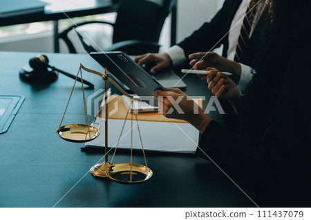Judge gavel with Justice lawyers having team meeting at law firm background. Concepts of Law and Legal services. Judge gavel with Justice lawyers having team meeting at law firm background. Concepts of Law and Legal services. 111437079
