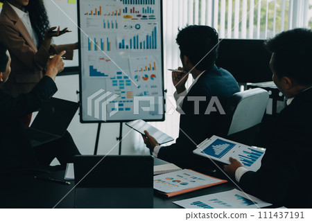 Business team meeting working with new startup project, discussion and analysis data the charts and graphs. Digital tablet, calculator, laptop computer using, Business finance and accounting concept. Business team meeting working with new startup project, discussion and analysis data the charts and graphs. Digital tablet, calculator, laptop computer using, Business finance and accounting concept. 111437191