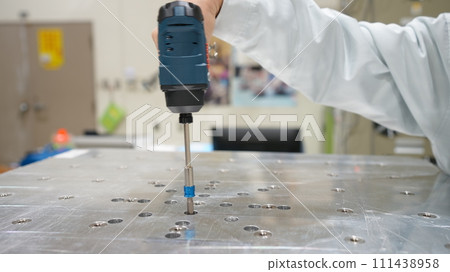 Workers inspecting at the factory 111438958