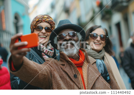 A group of seniors take a photo on a street 111440492