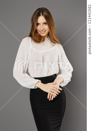 Happy woman in pencil skirt and blouse 111441081