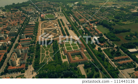 Aerial view of the city of Mantua involving former hippodrome park and renovated public space, Italy 111443116