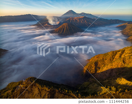 Aerial drone view of Bromo active volcano at sunrise,Tengger Semeru national park, East Java, Indonesia Aerial drone view of Bromo active volcano at sunrise,Tengger Semeru national park, East Java, Indonesia 111444256
