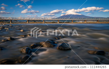 Bullet train passing Mount Fuji and the Fujikawa bridge, Shizuoka, Japan 111444265