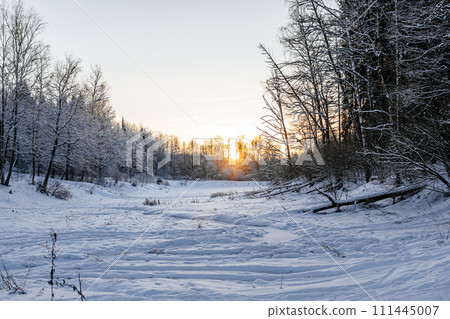 winter landscape on a pond. beautiful winter sunset. snowy nature landscape winter landscape on a pond. beautiful winter sunset. snowy nature landscape 111445007
