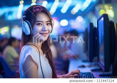 Smiling Asian girl with headphones and microphone in a call center 111447124