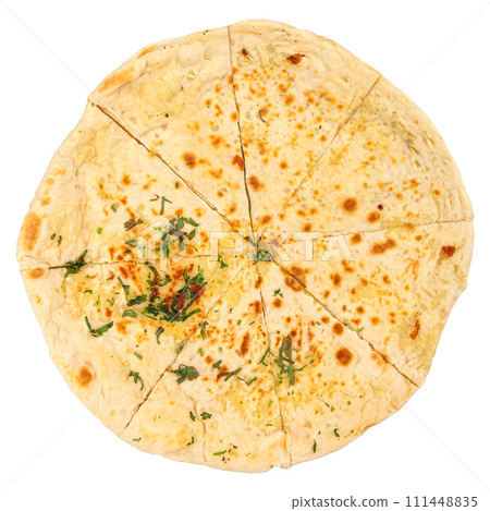 Caucasian flatbread khychin with herbs top view Caucasian flatbread khychin with herbs top view 111448835