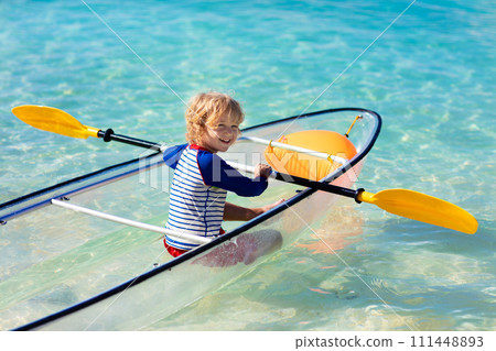 Kids kayaking in ocean. Family in kayak in tropical sea 111448893