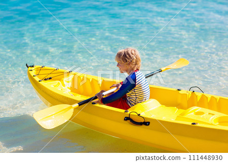Kids kayaking in ocean. Family in kayak in tropical sea 111448930