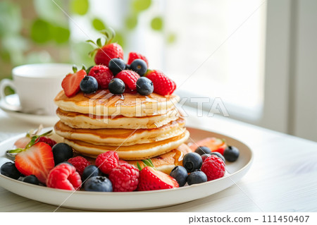 Plate of classic pancakes topped with fresh berries. Healthy summer breakfast. Generative AI 111450407