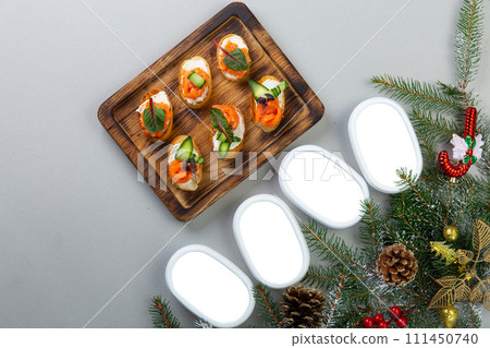 Set of sandwiches with smocked salmon, cucumber and cottage cheese 111450740