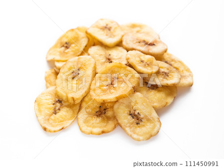 Dried dehydrated banana chips isolated on white background. 111450991