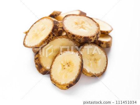 Fresh raw organic banana slices with brown spots on white background.Macro 111451034