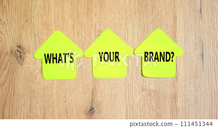 Branding and what is your brand symbol. Concept words What is your brand on beautiful yellow paper houses. Beautiful wooden background. Business branding and what is your brand concept. Copy space. 111451344