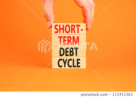 Short-term debt cycle symbol. Concept words Short-term debt cycle on beautiful wooden block. Beautiful orange table background. Businessman hand. Business Short-term debt cycle concept. Copy space. Short-term debt cycle symbol. Concept words Short-term debt cycle on beautiful wooden block. Beautiful orange table background. Businessman hand. Business Short-term debt cycle concept. Copy space. 111451361