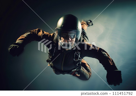 man in special uniform jumps with parachute, soars in air against background of sky, clouds. man in special uniform jumps with parachute, soars in air against background of sky, clouds. 111451792