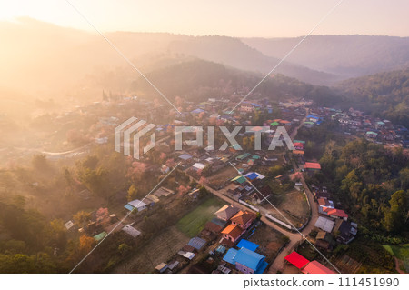 Sunrise over Thai tribe village in foggy with wild himalayan cherry tree blooming at Ban Rong Kla, Thailand Sunrise over Thai tribe village in foggy with wild himalayan cherry tree blooming at Ban Rong Kla, Thailand 111451990