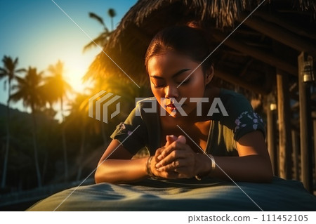 A beautiful woman is resting while caring for flowers on the window. A beautiful woman is resting while caring for flowers on the window. 111452105