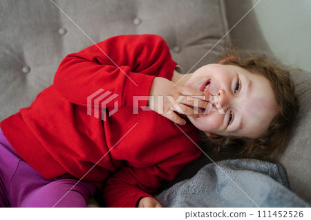 Funny little girl smiling, child looking at camera at home, happy childhood 111452526
