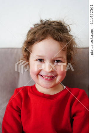 Funny little girl smiling, child looking at camera at home, happy childhood 111452561