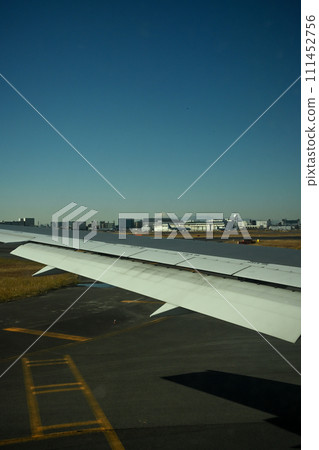 Airplane wing running on the runway 111452756