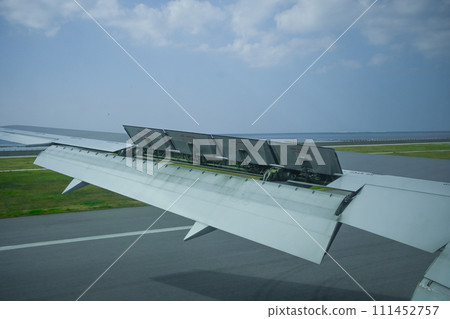 Airplane wing running on the runway 111452757