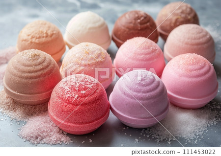 Variety of colorful bath bombs balls for bathing on a marble background Variety of colorful bath bombs balls for bathing on a marble background 111453022