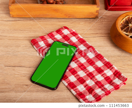 Berlin Germany January 21 2024 Iphone screen mockup, mobile phone mock up on kitchen table Berlin Germany January 21 2024 Iphone screen mockup, mobile phone mock up on kitchen table 111453663