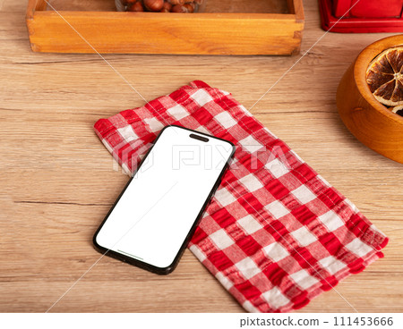 Berlin Germany January 21 2024 Iphone screen mockup, mobile phone mock up on kitchen table 111453666