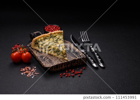 Delicious crispy quiche cut into slices with cheese, broccoli, tomatoes Delicious crispy quiche cut into slices with cheese, broccoli, tomatoes 111453991
