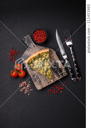 Delicious crispy quiche cut into slices with cheese, broccoli, tomatoes Delicious crispy quiche cut into slices with cheese, broccoli, tomatoes 111453993