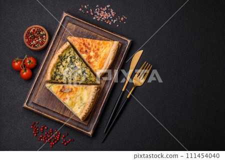 Delicious crispy quiche cut into slices with cheese, broccoli, tomatoes Delicious crispy quiche cut into slices with cheese, broccoli, tomatoes 111454040