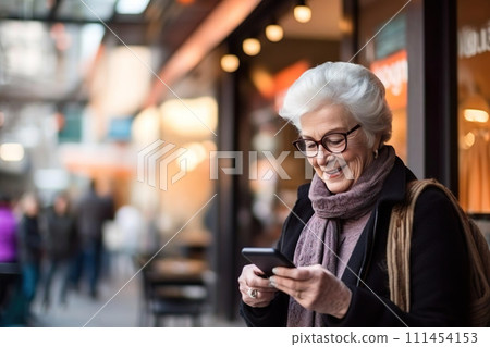 Happy old senior woman, granny using mobile phone, smiling, looking at smartphone, texting. Happy old senior woman, granny using mobile phone, smiling, looking at smartphone, texting. 111454153