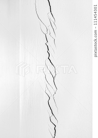 Deep crack in the corner of the room. White wall cracked. Problems of construction and repair. Deep crack in the corner of the room. White wall cracked. Problems of construction and repair. 111454301