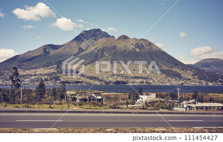 Rural landscape seen from a road, color toned photo, Ecuador. Rural landscape seen from a road, color toned photo, Ecuador. 111454427