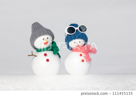 White snow field and snowman pair 111455135