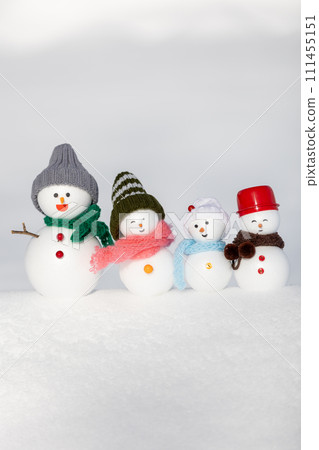 White snow field and snowman family 111455151